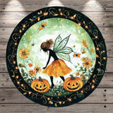 A fairy with a green fairy tail and wings is surrounded by pumpkins, flowers, and butterflies in a circular frame with a black border and gold accents.