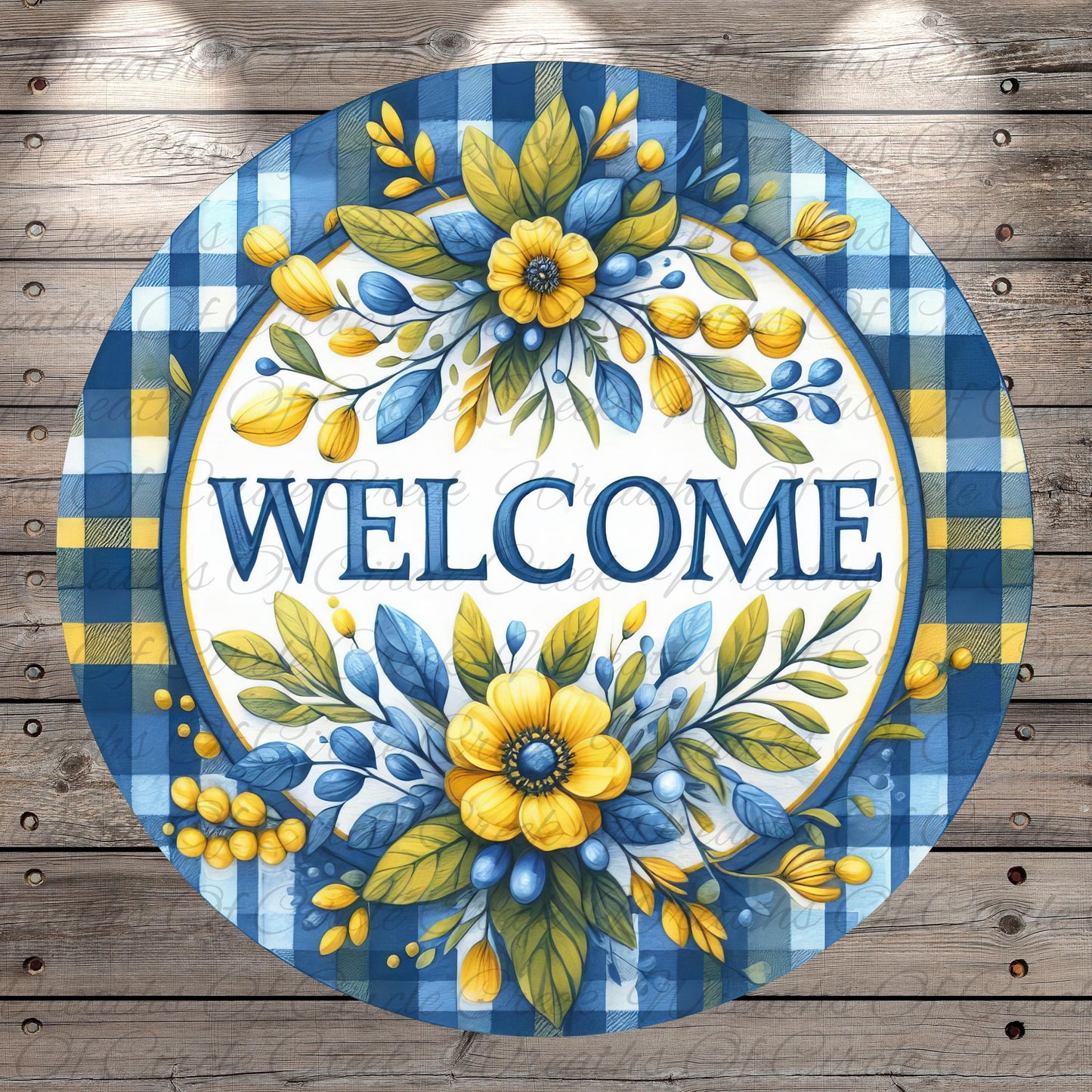 A circular welcome sign with a blue and yellow floral design, featuring the word "WELCOME" prominently displayed in the center.