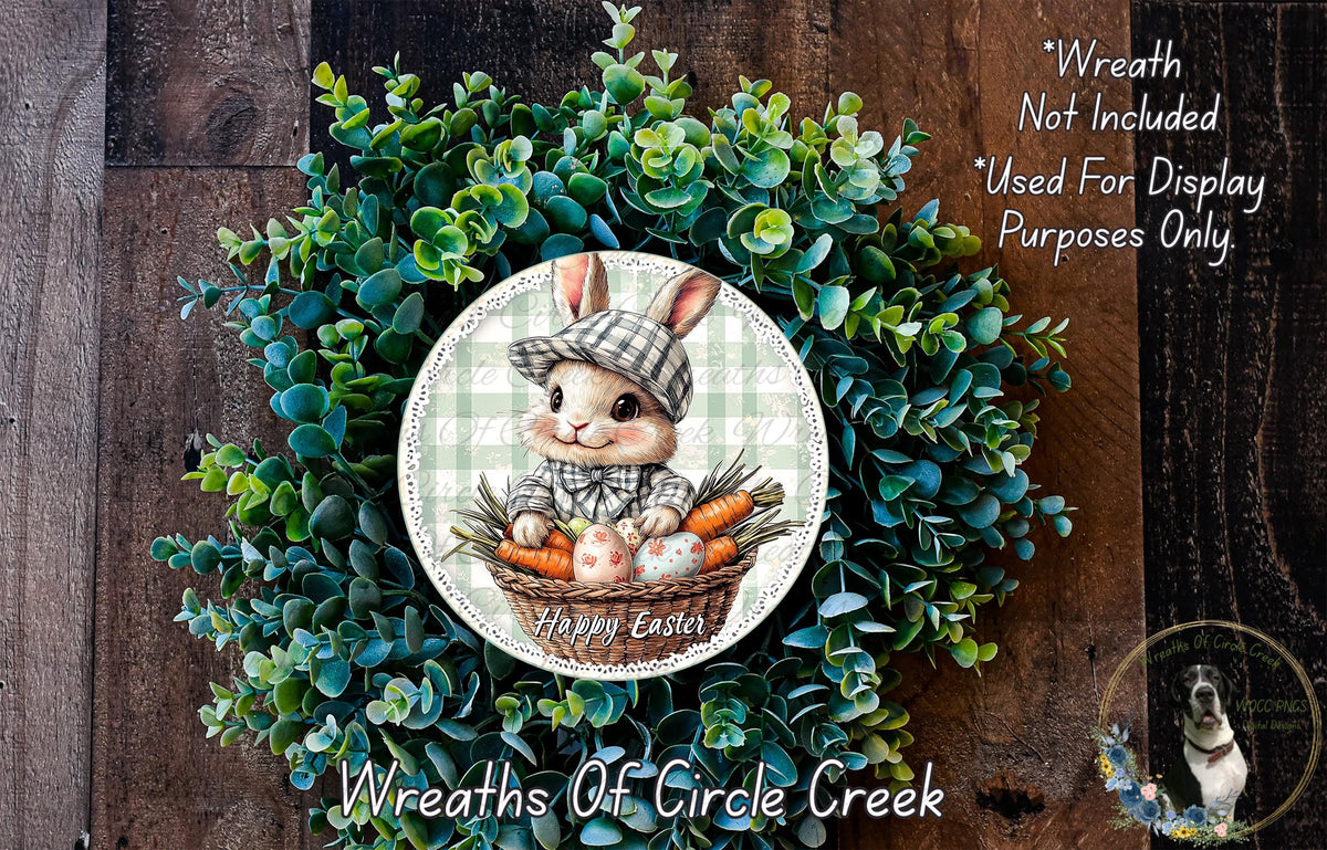 a wreath with a bunny wearing a hat and holding a basket of carrots, surrounded by a lush green plant. The wreath is displayed on a wooden surface, and there is a text overlay that reads "Happy Easter" and "Wreaths of Circle Creek".