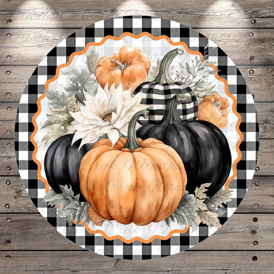 A circular arrangement of pumpkins and flowers on a wooden background, with a black and white checkered border.