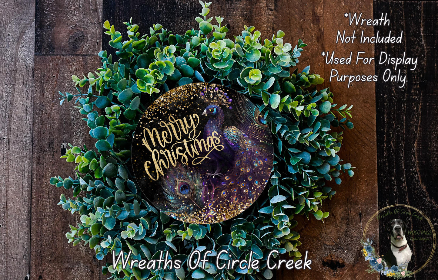 A wreath made of green and purple plants, with a gold and purple peacock feather design, and the text "Merry Christmas" written on it.