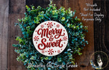 A wreath made of green leaves and red and white candy canes, with the text "Merry & Sweet" displayed on the wreath.