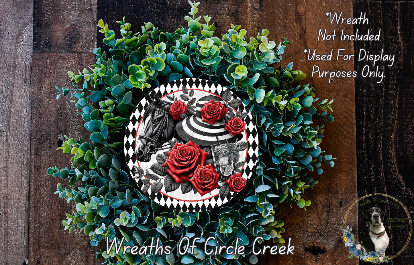 The image is a wreath made of various green plants and red roses, with a decorative plate featuring a horse and a woman on it. The wreath is displayed on a wooden surface, and there is a text overlay that reads "Wreath Not Included * Used For Display Purposes Only".