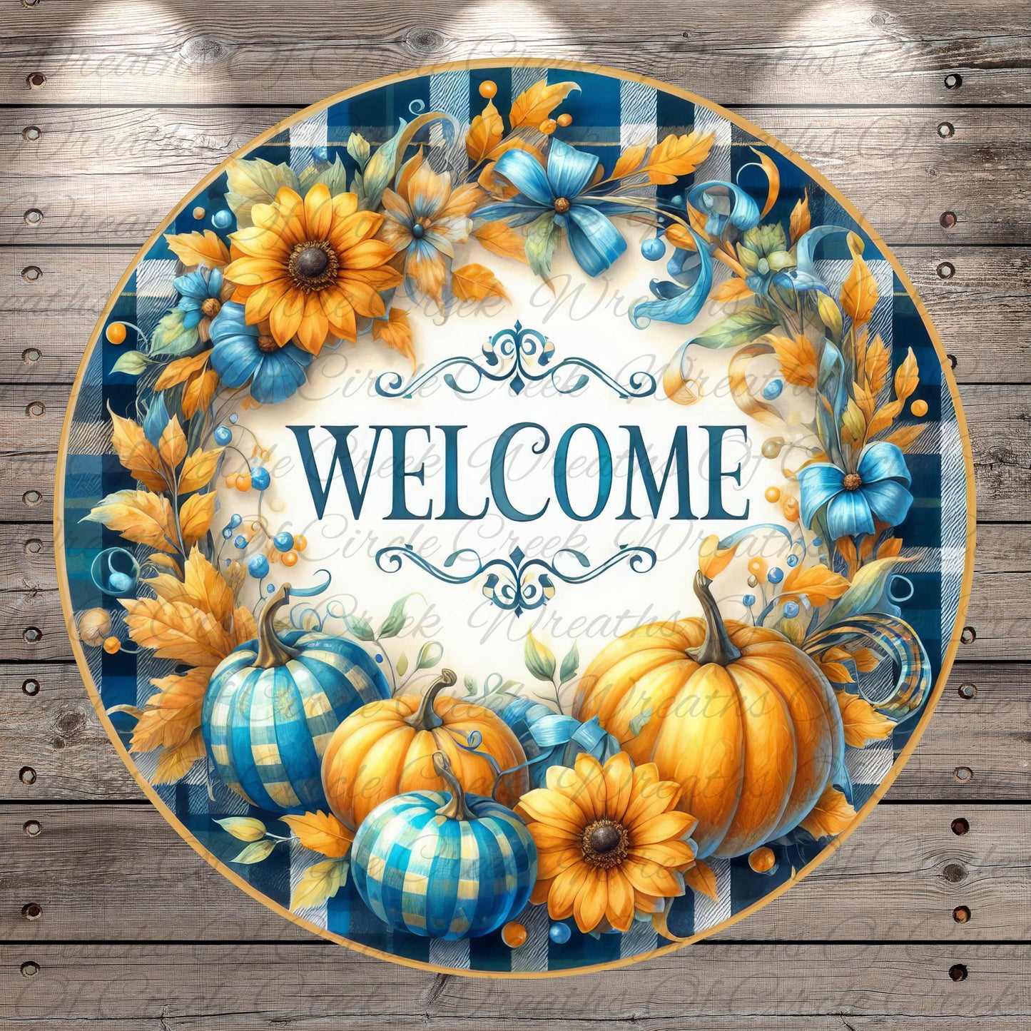 A decorative welcome sign featuring a blue and white plaid border, surrounded by a wreath of autumn leaves and flowers, with pumpkins and sunflowers.