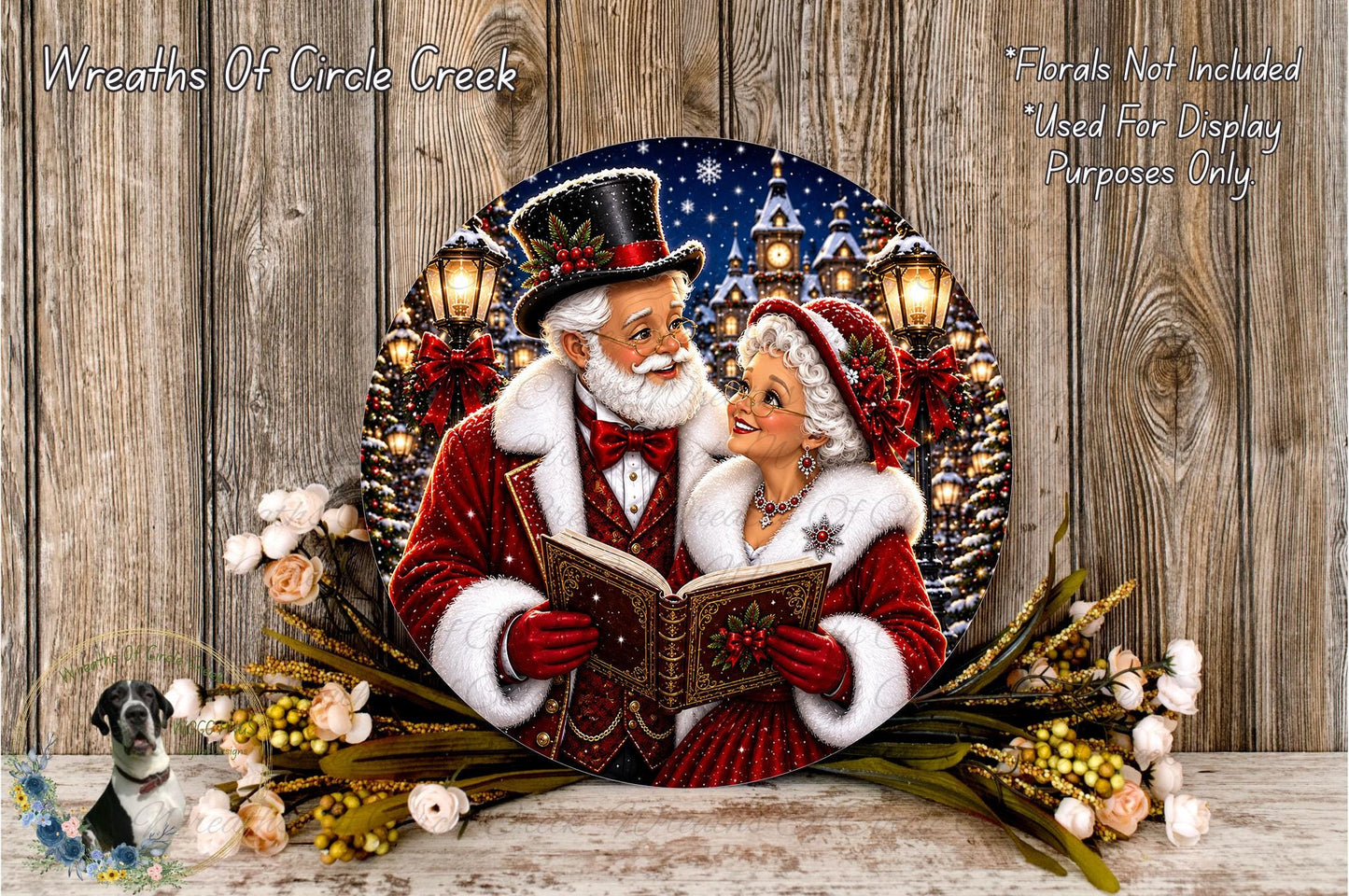 A decorative plate featuring a couple dressed in traditional red and white holiday attire, with Santa Claus and a book, surrounded by a wreath of flowers and a snowy landscape.
