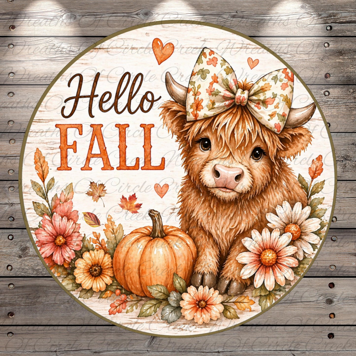 A decorative round sign featuring a brown cow with a bow, surrounded by autumn-themed elements such as flowers, leaves, and a pumpkin. The sign has the text "Hello Fall" written on it.