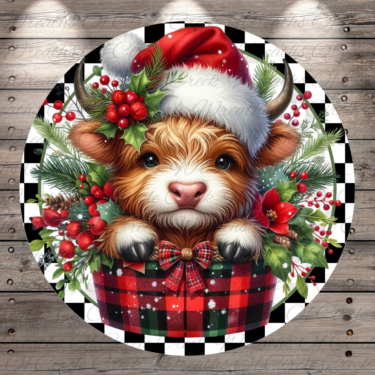 A cow wearing a Santa hat and surrounded by Christmas decorations, including berries, pine branches, and a plaid blanket.