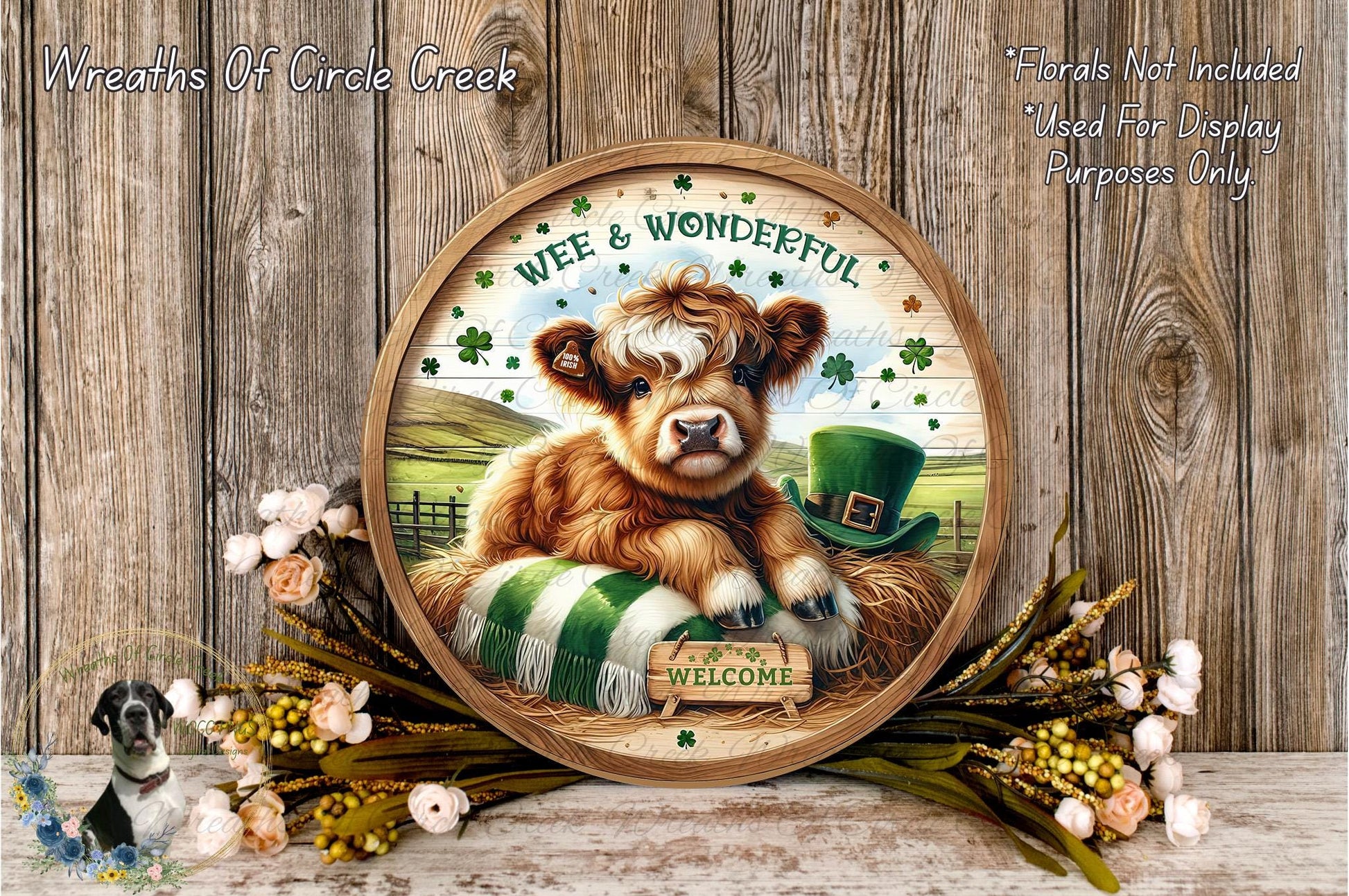 A wooden sign with a cartoon cow wearing a green hat and surrounded by flowers, with the text "Welcome" and "Wee & Wonderful" on it.