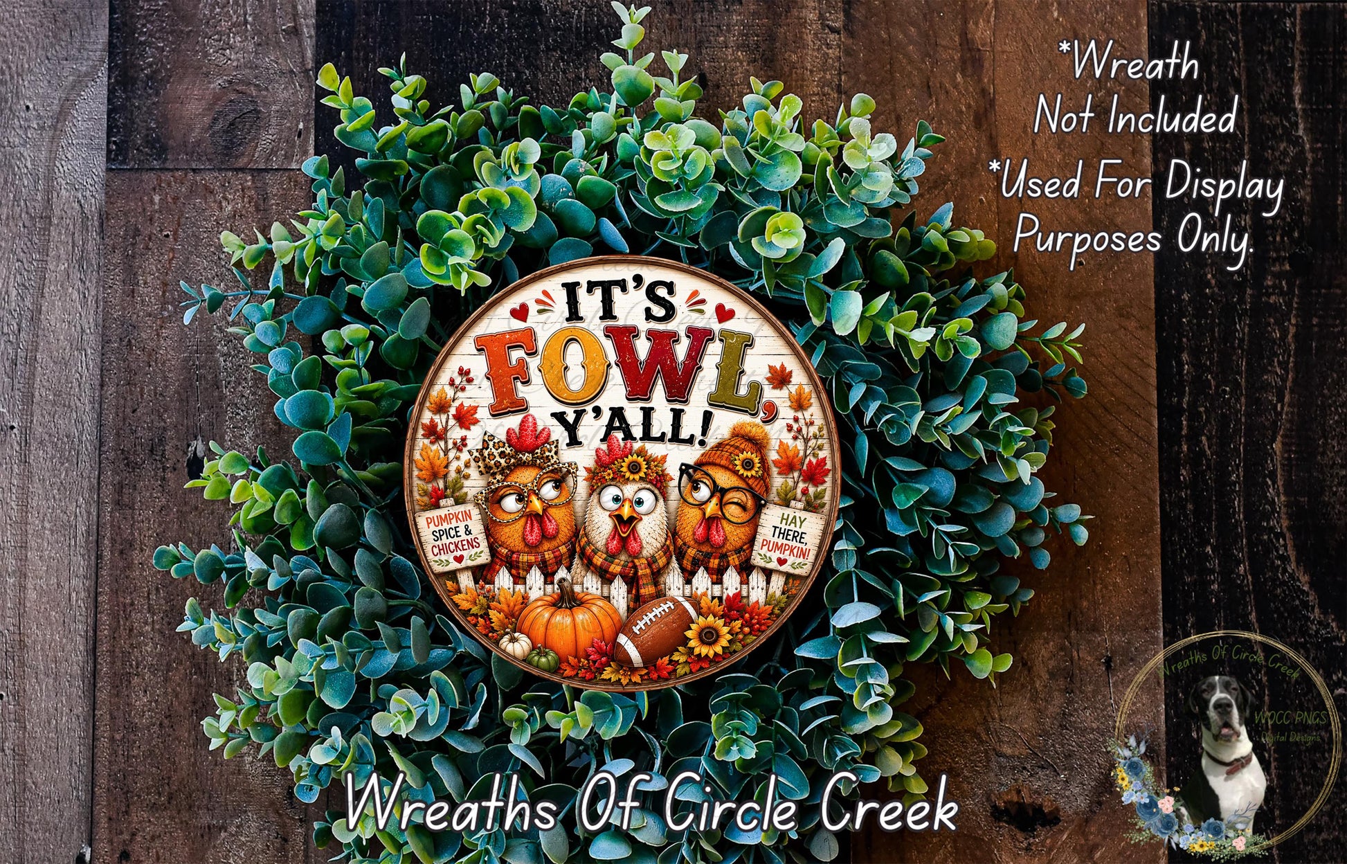 A wreath made of green leaves and featuring a decorative design with a central text that says "It's Fowl Y'all!"