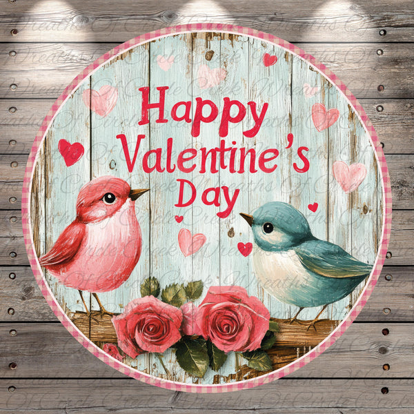 A circular graphic with a wooden background, featuring two birds, pink and blue, and pink and red hearts. The text "Happy Valentine's Day" is displayed in the center of the image.