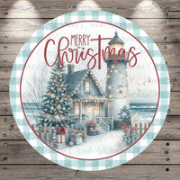 A circular Christmas-themed design featuring a lighthouse, a decorated Christmas tree, and a house with lights, all set against a snowy landscape.