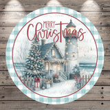 A circular Christmas-themed design featuring a lighthouse, a decorated Christmas tree, and a house with lights, all set against a snowy landscape.