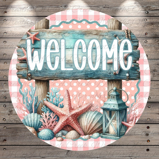 A circular wooden sign with the word "WELCOME" written on it, surrounded by various seashells, starfish, and a lantern.