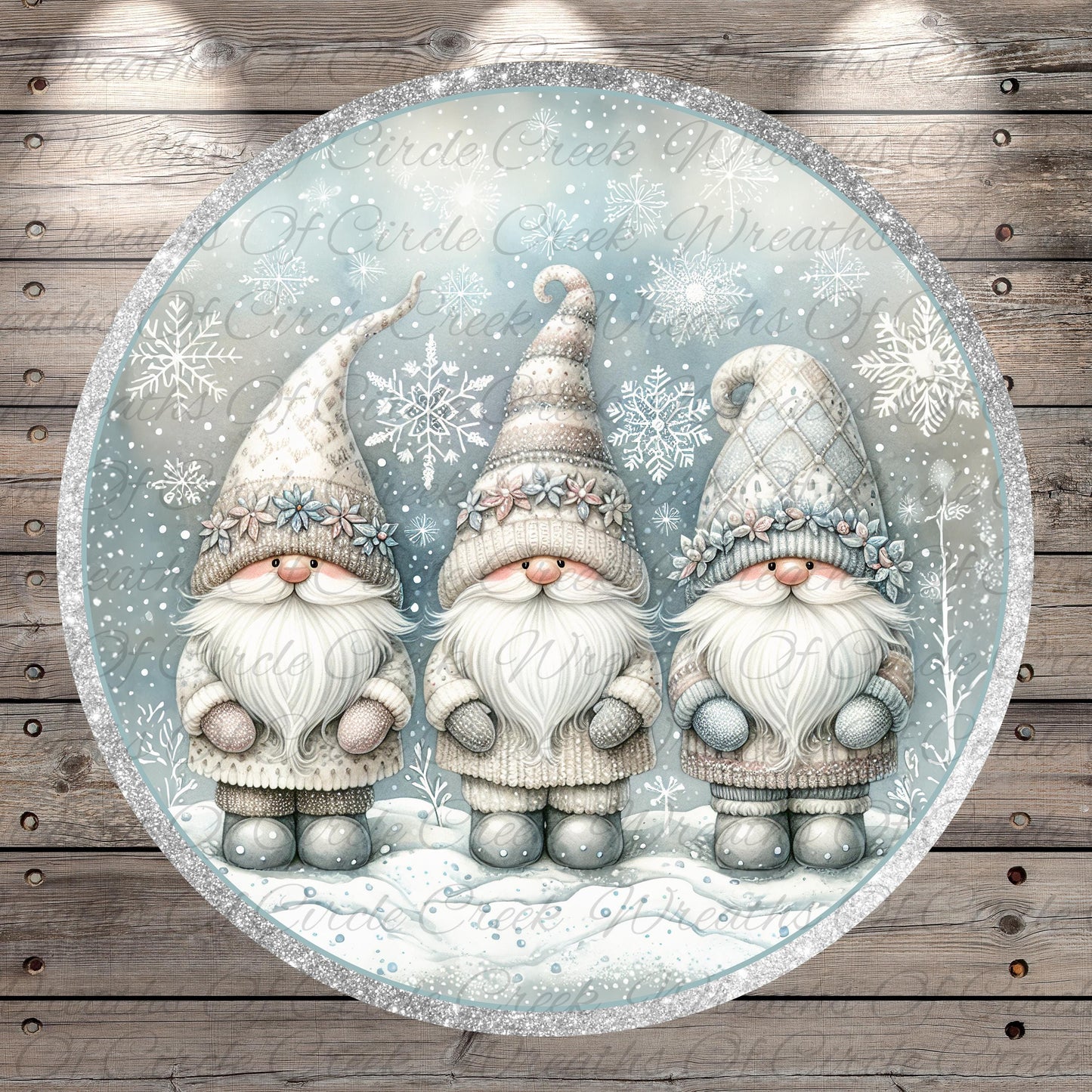 A circular illustration featuring three gnomes wearing winter clothing and hats, set against a snowy background with snowflakes.