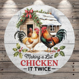 A round wooden sign with a rooster and a small cabin, surrounded by holly and berries, with the text "Making a List CHICKEN IT TWICE" displayed prominently.