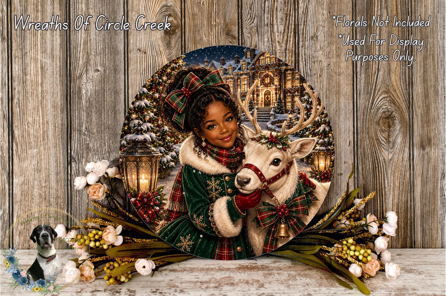A woman in a green coat and red scarf is holding a white reindeer with a red bow around its neck, standing next to a Christmas tree. The scene is surrounded by a wreath of flowers and a lantern, creating a festive atmosphere.