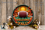 A decorative football-themed wreath with a football, autumn leaves, and a sun in the background, surrounded by flowers and a wooden fence.