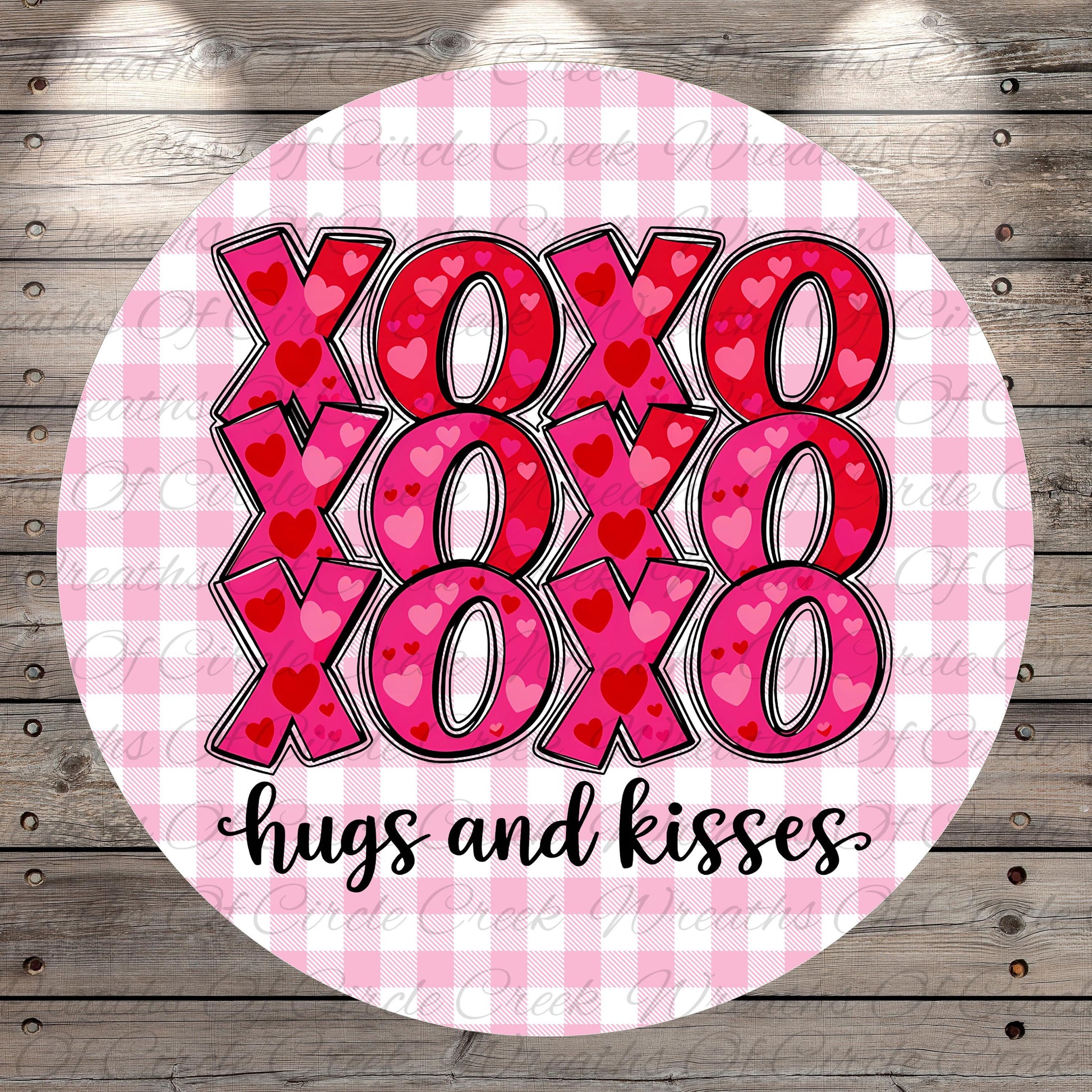 A circular design with the text "XOXO XOXO XOXO hugs and kisses" written in a cursive font.