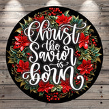A circular wreath with red poinsettia flowers and greenery surrounding a message that reads &quot;Christ the Saviour is born&quot;.