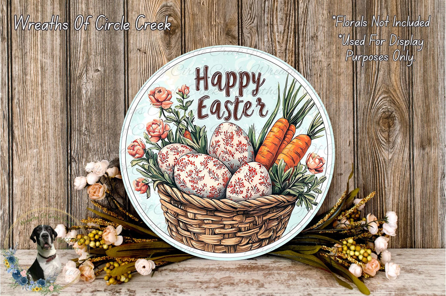 A round sign with the text "Happy Easter" and an illustration of a basket filled with Easter eggs, carrots, and flowers, placed on a wooden surface.