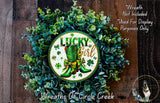 a wreath with the text "Lucky Girl" and a pair of green boots, surrounded by greenery.