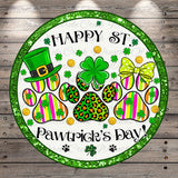 A circular design with a green border and a white background, featuring a green hat, four-leaf clover, leopard print paw prints, and the text "Happy St. Pawtruck's Day!"