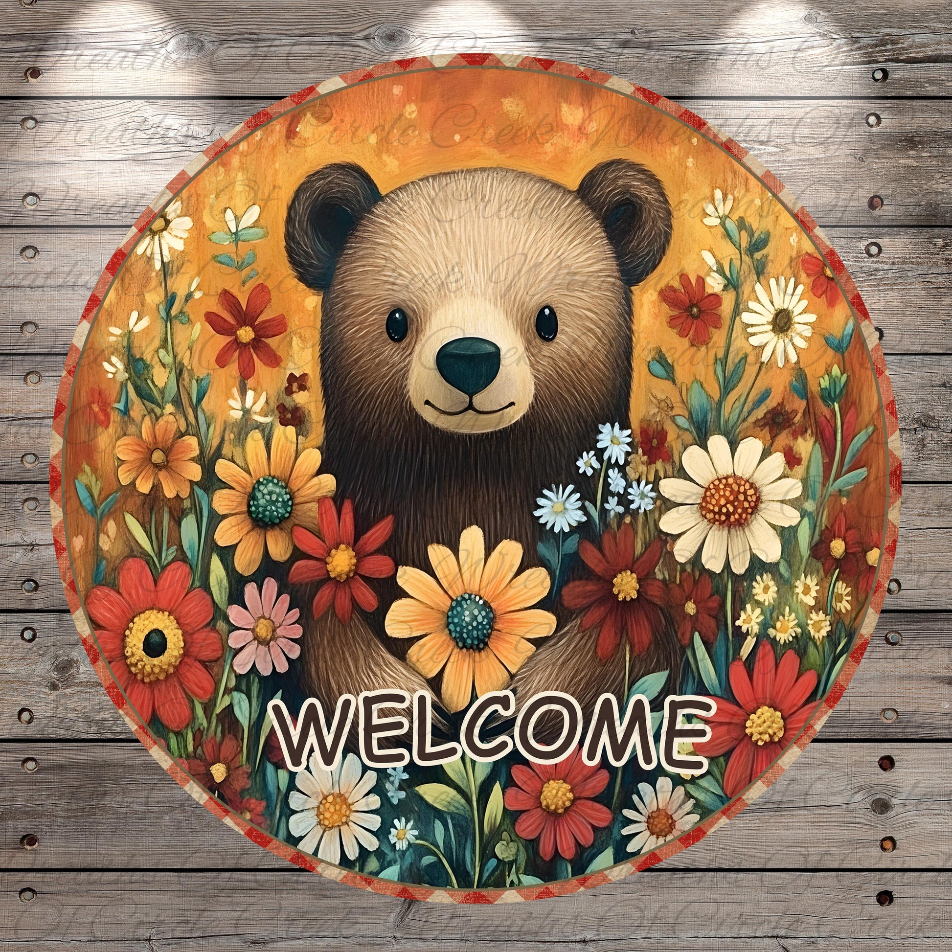 A circular sign featuring a brown bear surrounded by a vibrant array of colorful flowers, with the word "WELCOME" prominently displayed in the center.