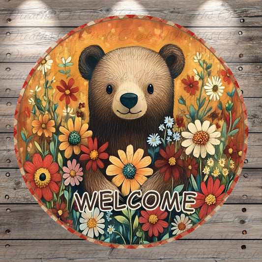 A circular sign featuring a brown bear surrounded by a vibrant array of colorful flowers, with the word "WELCOME" prominently displayed in the center.