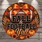 A circular sign with a football, autumn leaves, pumpkins, and sunflowers, along with the text "FALL & FOOTBALL YALL" written in a decorative font.