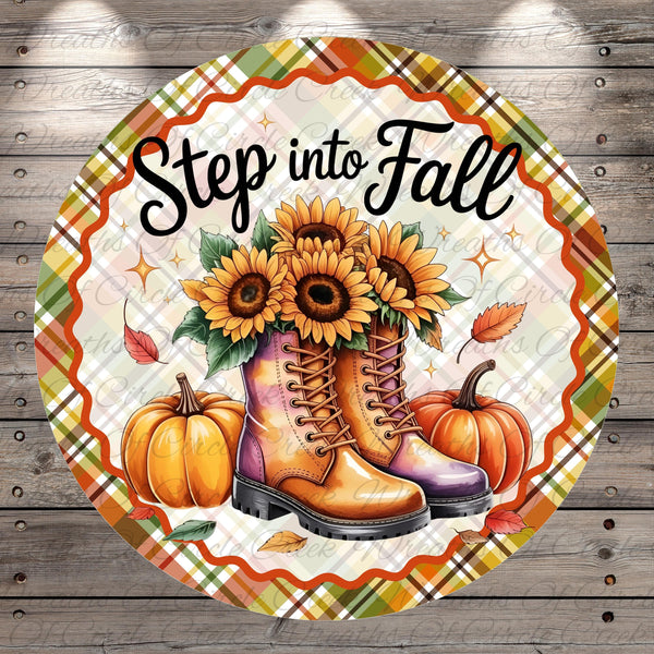 A round decorative plate with a plaid border, featuring a pair of boots, sunflowers, pumpkins, and leaves, along with the text "Step into Fall".