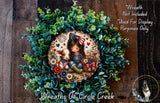 a wreath with a young girl and a cow, surrounded by green foliage. The wreath is displayed on a wooden surface, and there is a text overlay that reads "Wreath Not Included * Used For Display Purposes Only".