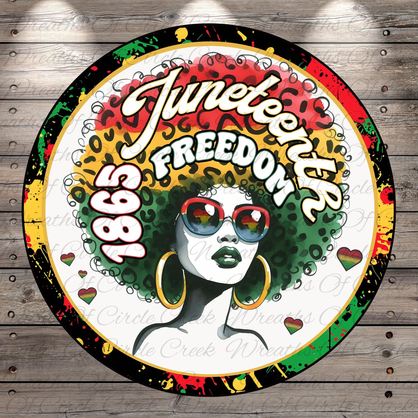 A colorful circular logo featuring a stylized illustration of a woman with a large afro hairstyle, sunglasses, and the text "JUNEEENTH" and "FREEDOM" prominently displayed.