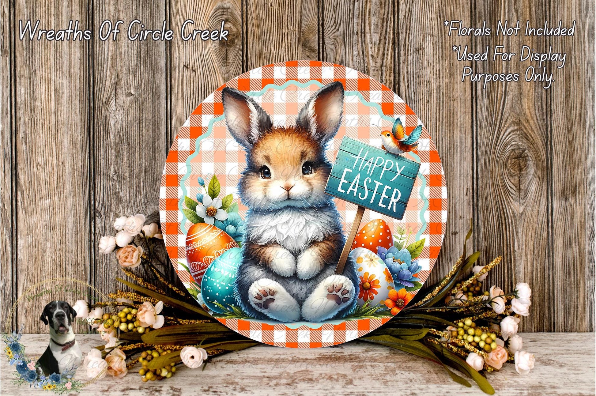 A round, decorative plate featuring a cartoon rabbit holding a sign that says "Happy Easter" surrounded by Easter eggs, flowers, and a bird.
