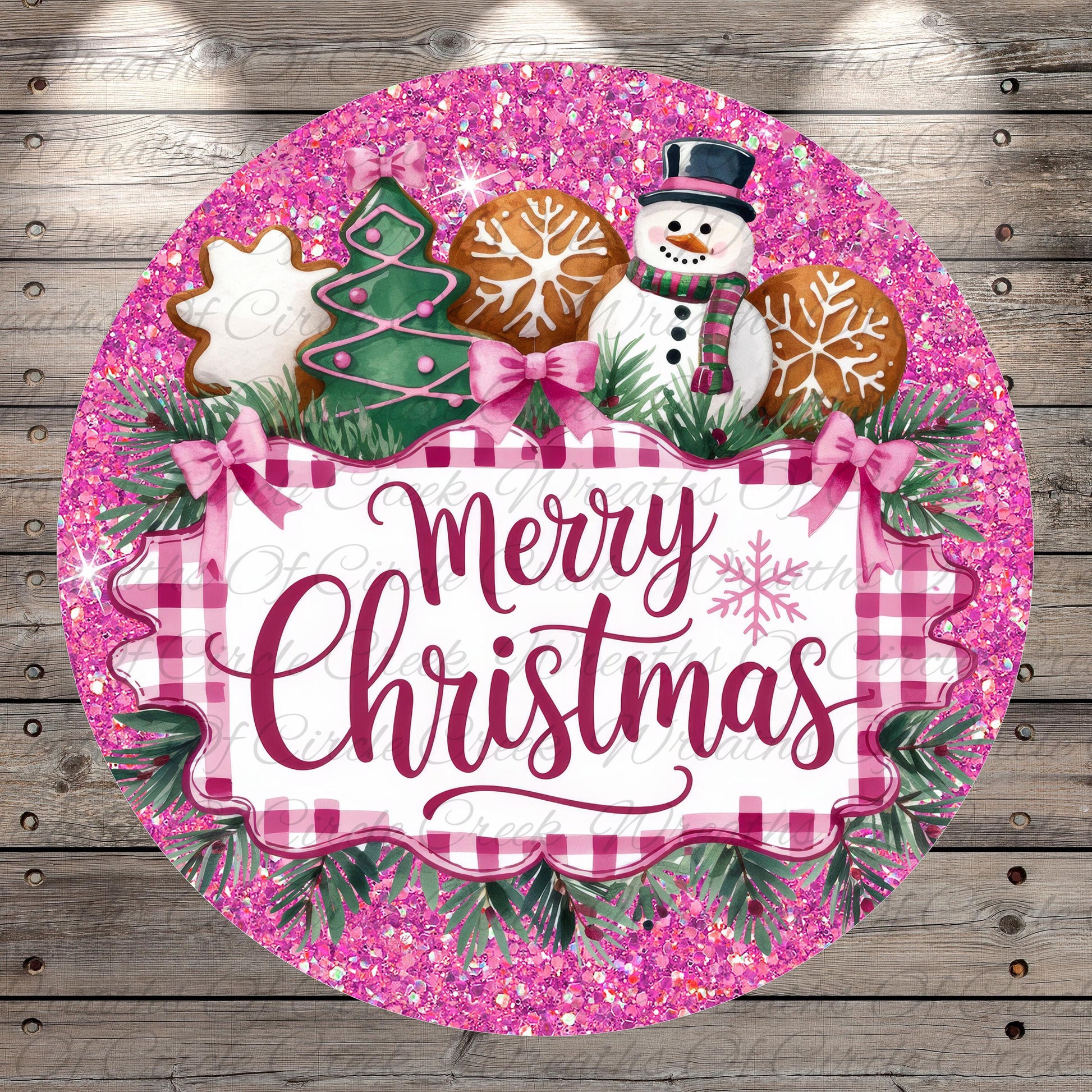 A festive Christmas-themed round sign with a pink and white checkered border, surrounded by a glittery pink background. The sign features a snowman, gingerbread cookies, and a "Merry Christmas" message.