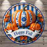 A decorative round sign with a blue and white floral pattern, featuring a large orange pumpkin surrounded by smaller pumpkins and orange flowers. The sign has a banner that says &quot;Happy Fall&quot;.