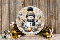 A snowman wearing a black hat and scarf, surrounded by a wreath of flowers and ornaments, against a wooden background.