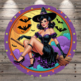 A woman dressed as a witch, wearing a black dress and a pointed hat, is depicted in a circular frame with a Halloween-themed background.