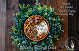 a wreath with a picture of a scarecrow and sunflowers