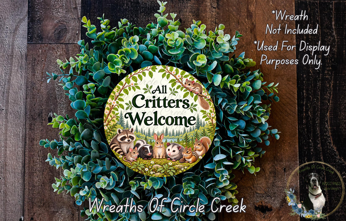 a wreath made of various green plants and a sign that reads "All Critters Welcome". The sign is surrounded by a lush, natural-looking wreath.