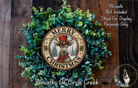 A wreath with a deer wearing a top hat and scarf, surrounded by greenery, with the text "MERRY CHRISTMAS" and "Wreaths of Circle Creek" displayed.
