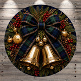 A festive Christmas wreath adorned with a large plaid bow, golden bells, and various holiday decorations such as berries, pine cones, and ornaments.