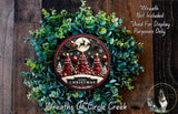 A Christmas wreath made of evergreen branches and topped with a red and white wreath, featuring a Santa Claus sleigh and a full moon.