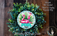 a wreath made of green leaves and a pink flamingo, with the word &quot;POOL&quot; prominently displayed in the center.