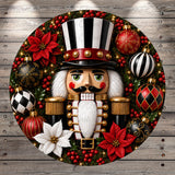 A decorative Christmas wreath featuring a nutcracker figure surrounded by ornaments, poinsettias, and other festive elements.