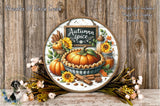 A decorative wreath featuring a pumpkin pie surrounded by autumn-themed elements such as pumpkins, sunflowers, and cinnamon sticks, set against a rustic wooden background.