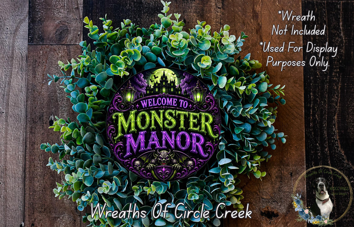a wreath with the text "Welcome to Monster Manor" and a spooky castle design, surrounded by green foliage.
