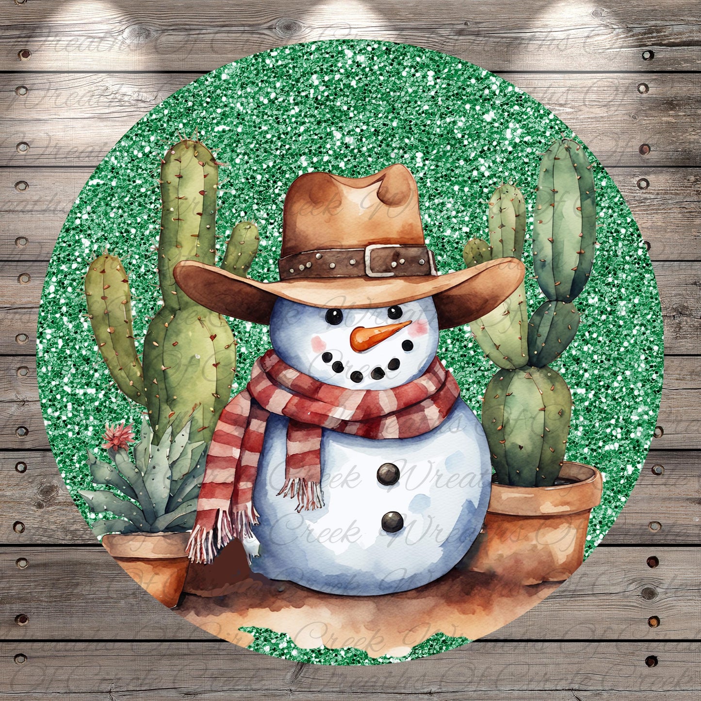 A snowman wearing a cowboy hat and scarf, surrounded by cacti, is depicted in a circular frame with a glittery green background.