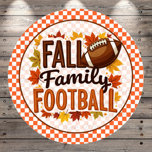 A circular sign with the text "FALL Family Football" surrounded by autumn leaves and a football.
