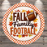 A circular sign with the text "FALL Family Football" surrounded by autumn leaves and a football.