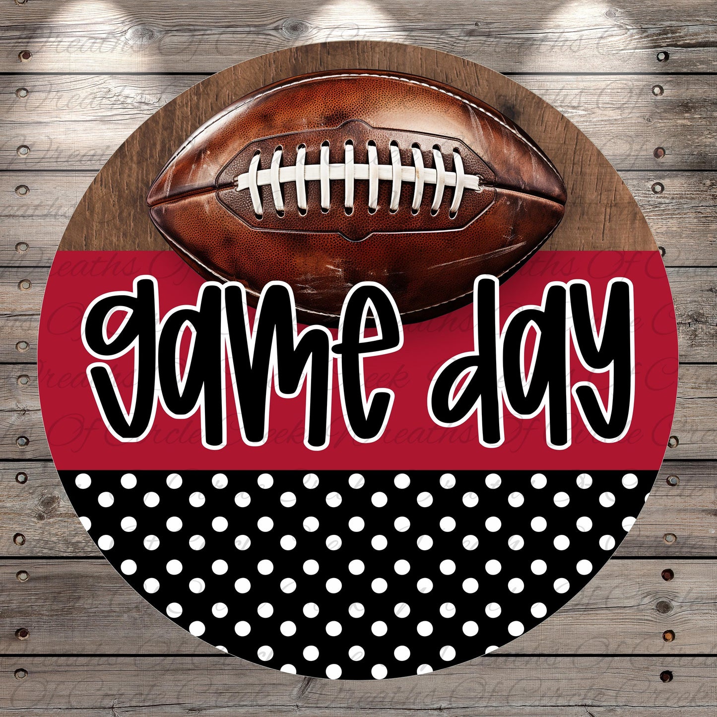 A football is displayed on a wooden surface, with the text "game day" written in a stylized font below it.